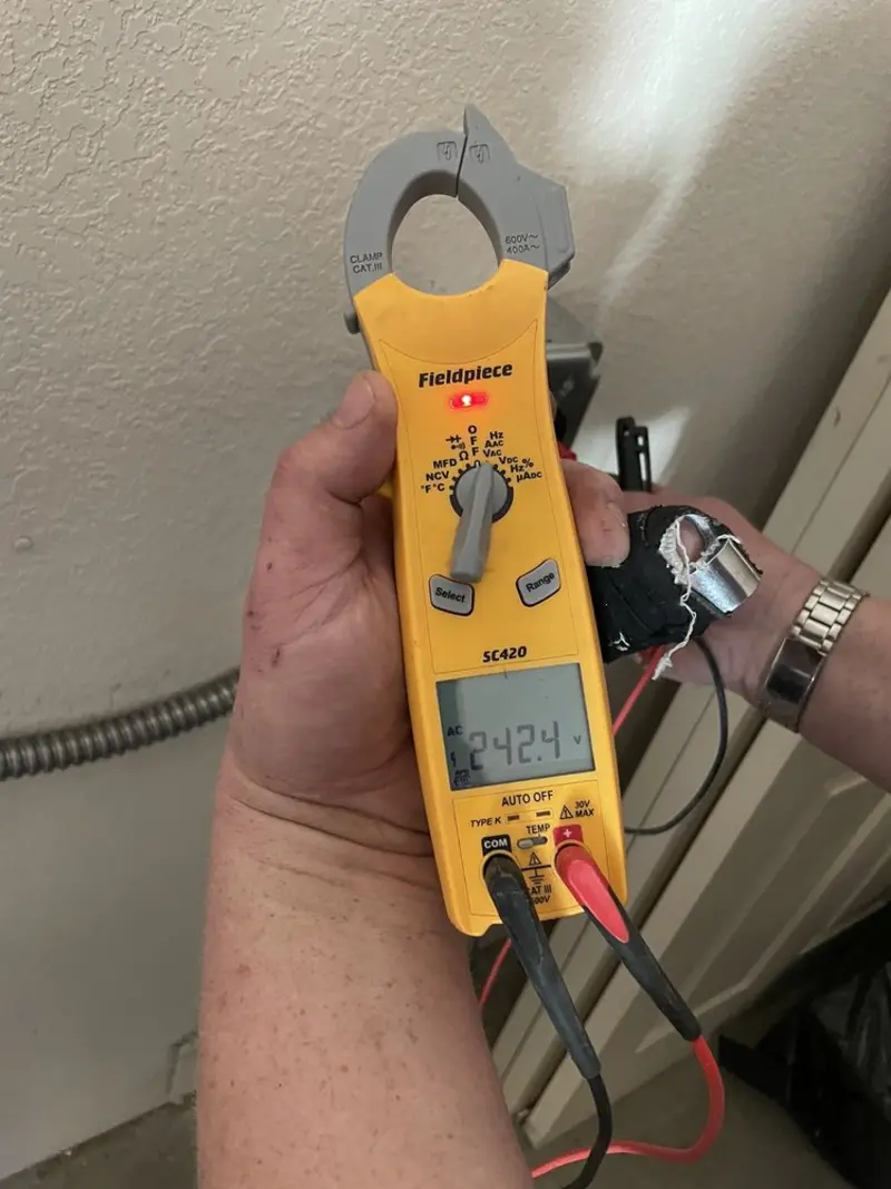 Voltage testing with clamp meter during Circuit Breaker Repair in Tilden